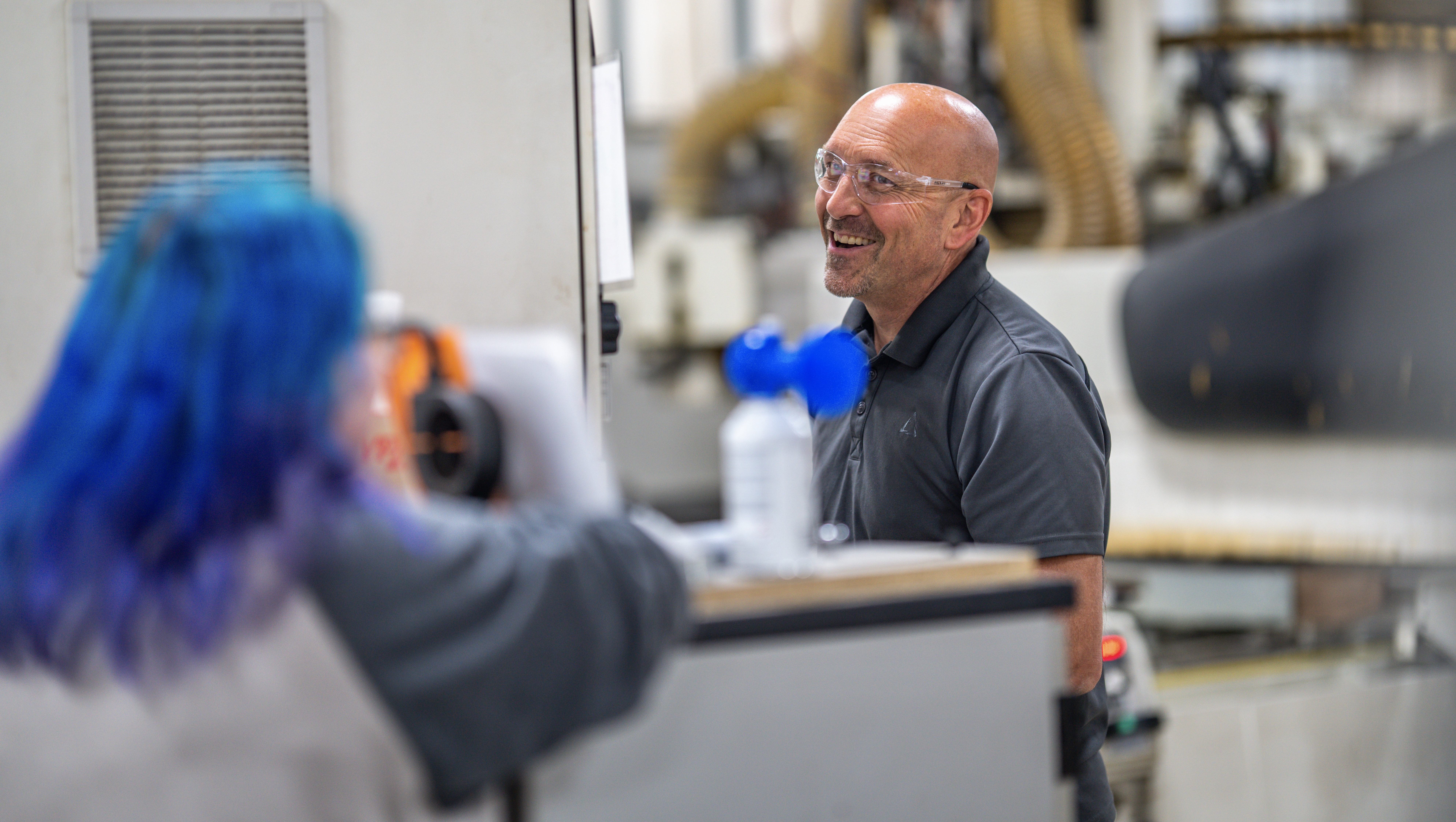 Scott talking with other employee