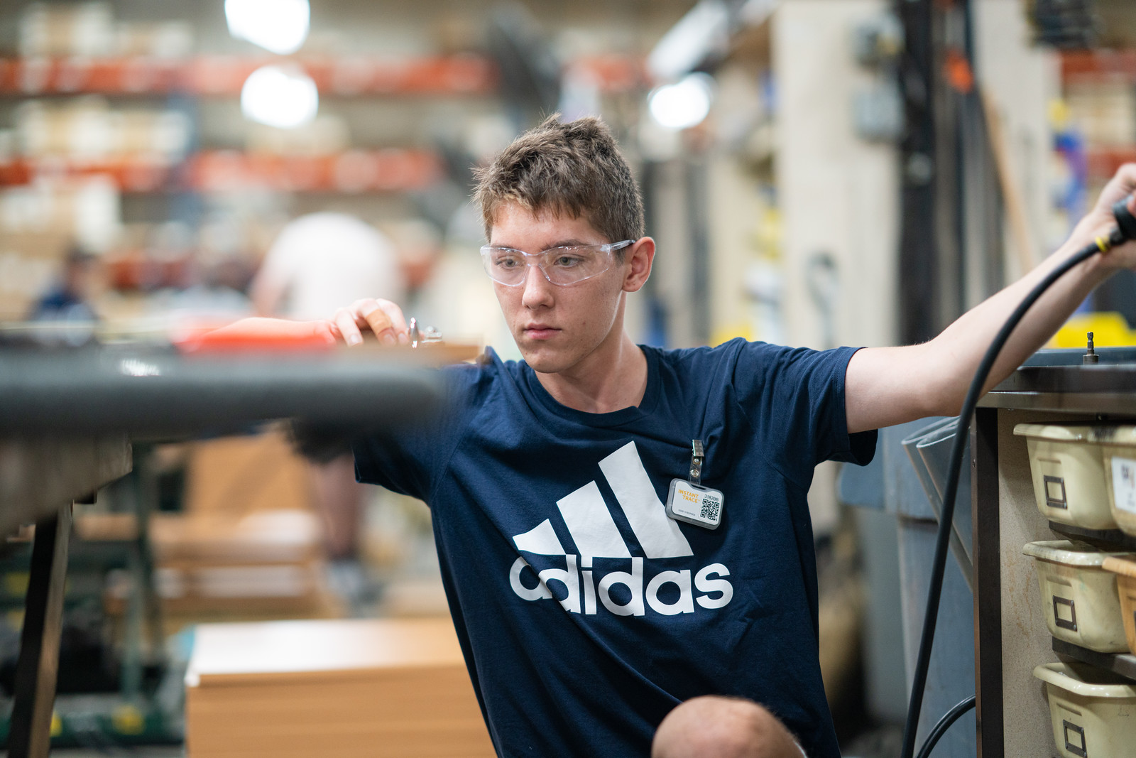 Summer student working at assembly bench